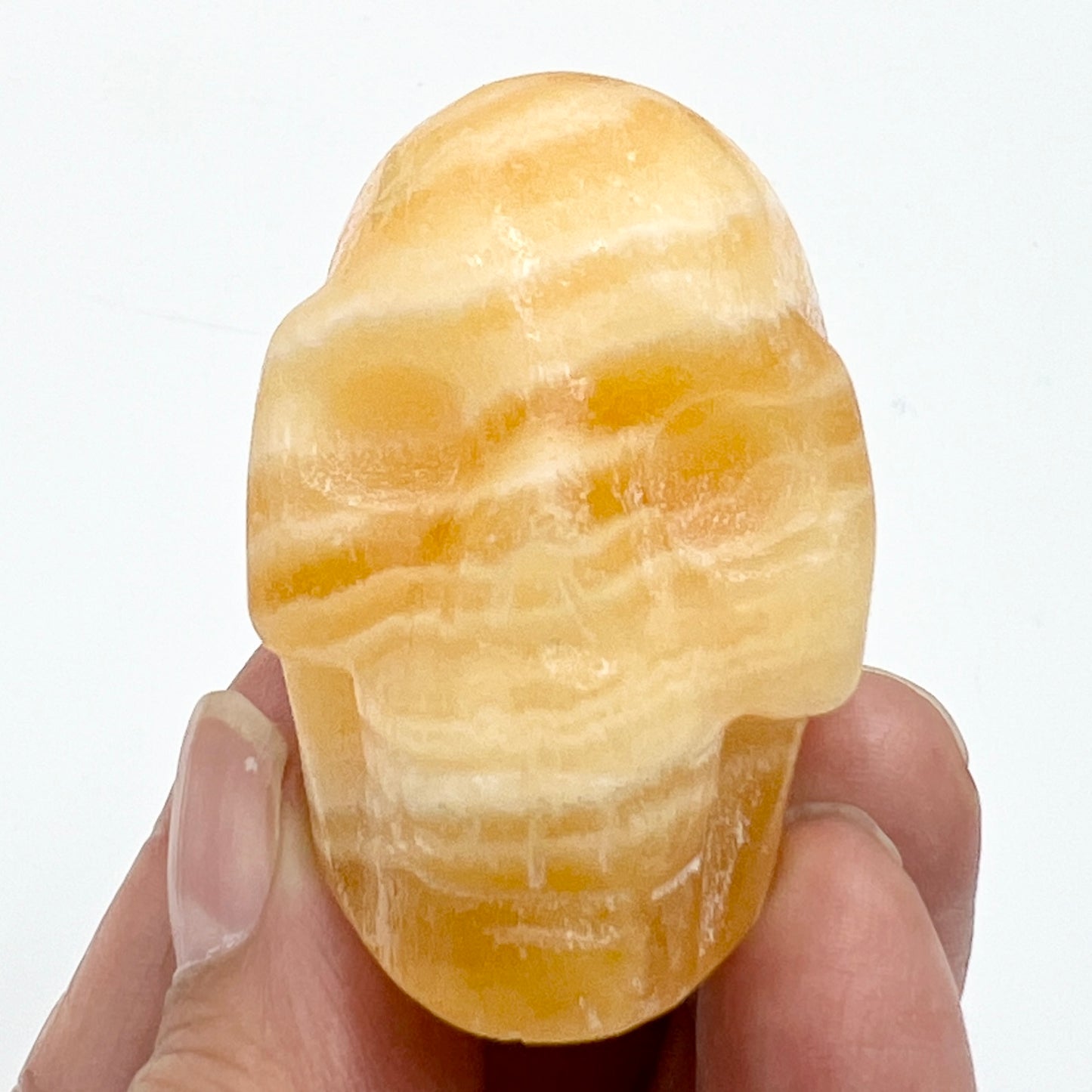 Banded Orange Calcite Skull 2 Inches Hand Carved Crystal Carving