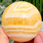 Banded Orange Calcite Sphere Healing Crystal Ball 488g 71mm